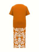 Plus Size Elegant Two-piece Set, Solid Crew Neck Short Sleeve Top & Floral Print Pants Outfits, Women's Plus Size Clothing
