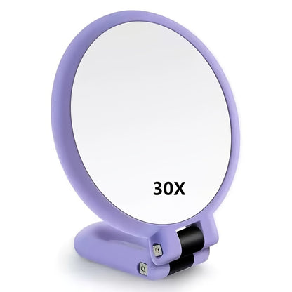 Espejo de maquillaje de mano de doble cara con aumento de 1X/30X y mango ajustable 360°. Diseño portátil y plegable para un cuidado preciso. Ideal para viajes. No necesita pilas. Marco negro con detalles dorados. Mini espejo.