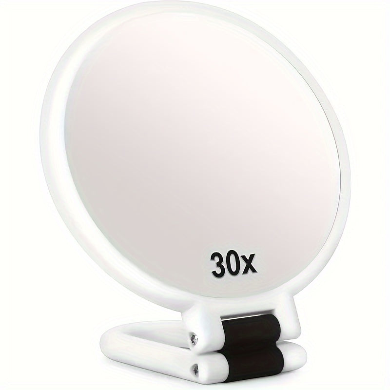 Espejo de maquillaje de mano de doble cara con aumento de 1X/30X y mango ajustable 360°. Diseño portátil y plegable para un cuidado preciso. Ideal para viajes. No necesita pilas. Marco negro con detalles dorados. Mini espejo.