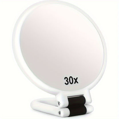 Espejo de maquillaje de mano de doble cara con aumento de 1X/30X y mango ajustable 360°. Diseño portátil y plegable para un cuidado preciso. Ideal para viajes. No necesita pilas. Marco negro con detalles dorados. Mini espejo.