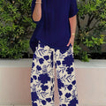 Plus Size Elegant Two-piece Set, Solid Crew Neck Short Sleeve Top & Floral Print Pants Outfits, Women's Plus Size Clothing