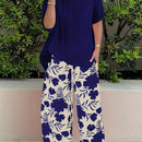 Plus Size Elegant Two-piece Set, Solid Crew Neck Short Sleeve Top & Floral Print Pants Outfits, Women's Plus Size Clothing