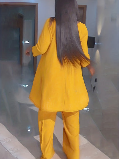 Conjunto de dos piezas de túnica y pantalón de cuello redondo de manga larga lisa para mujer de talla grande.