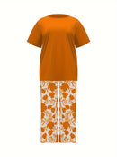 Plus Size Elegant Two-piece Set, Solid Crew Neck Short Sleeve Top & Floral Print Pants Outfits, Women's Plus Size Clothing