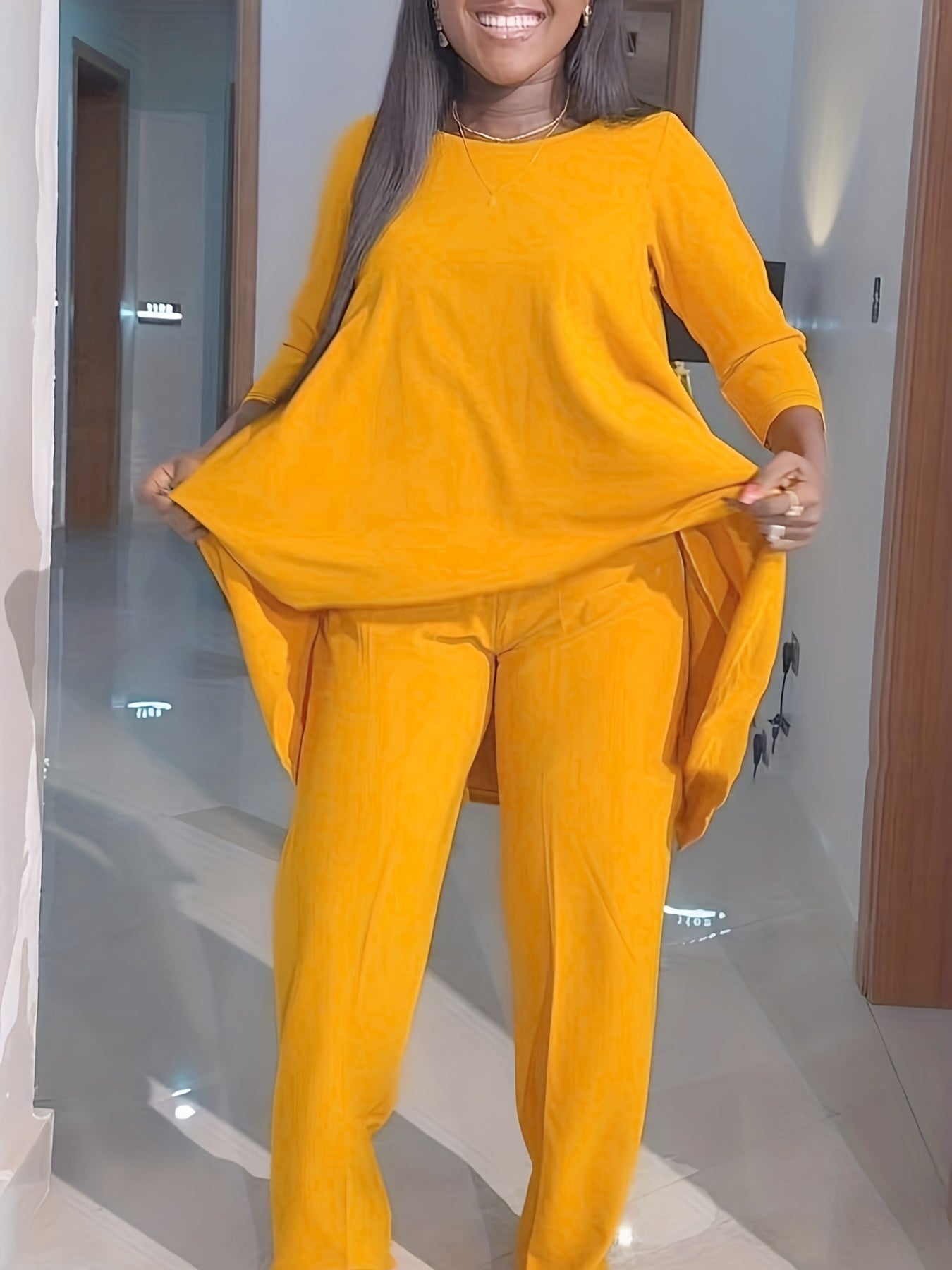 Conjunto de dos piezas de túnica y pantalón de cuello redondo de manga larga lisa para mujer de talla grande.