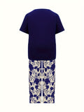 Plus Size Elegant Two-piece Set, Solid Crew Neck Short Sleeve Top & Floral Print Pants Outfits, Women's Plus Size Clothing