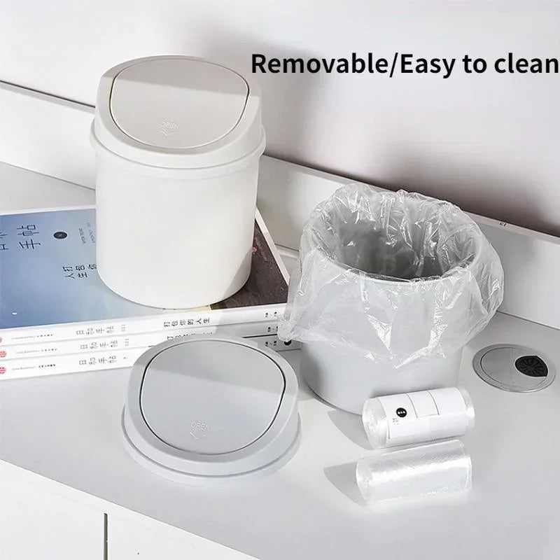 Mini bote de basura pequeño de escritorio con tapa, ideal para el dormitorio, la limpieza y el escritorio del hogar. 