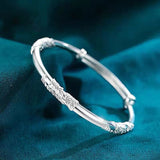 Pulsera de plata con flores para mujer, ajustable, delicada y abierta, color liso. 