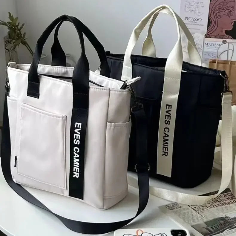 Nuevo bolso de hombro informal de gran capacidad, de nailon, impermeable, de lona, ​​sencillo y moderno, para colegiala.