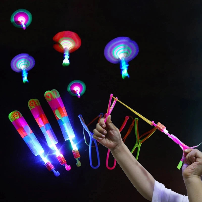 Increíble juguete luminoso, flecha LED, juguetes para fiestas al aire libre, divertido regalo, banda elástica, catapulta que brilla en la oscuridad, cohete, helicóptero, juguete volador.