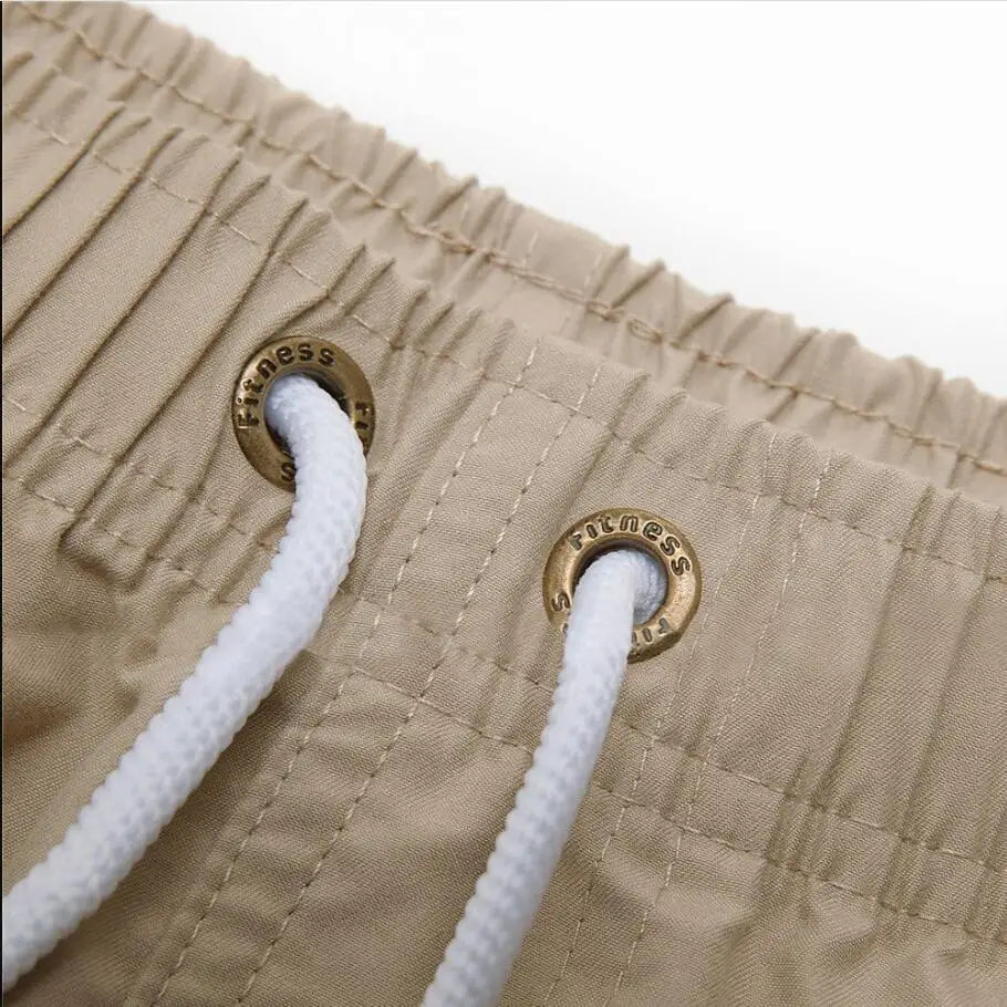 Bañador corto para hombre, de secado rápido, transpirable, con cordón y bolsillos para surfear en la playa en verano.