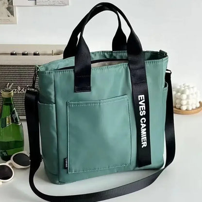 Nuevo bolso de hombro informal de gran capacidad, de nailon, impermeable, de lona, ​​sencillo y moderno, para colegiala.