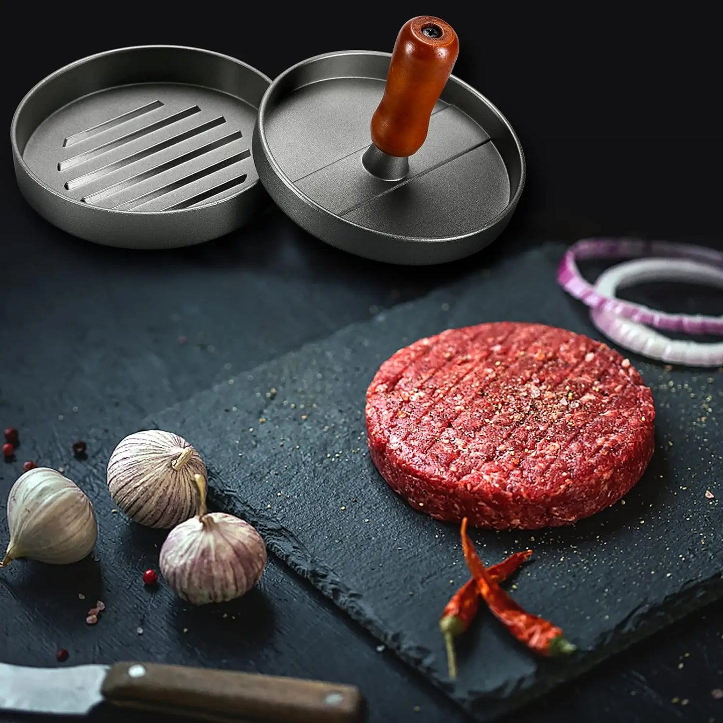Prensa para hamburguesas de acero inoxidable con mango de madera antiadherente y 100 hojas de papel.