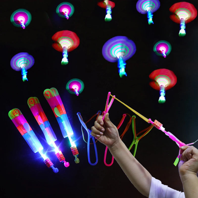 Increíble juguete luminoso, flecha LED, juguetes para fiestas al aire libre, divertido regalo, banda elástica, catapulta que brilla en la oscuridad, cohete, helicóptero, juguete volador.