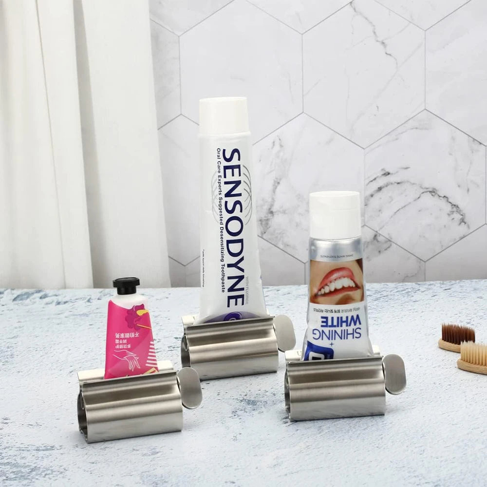 Accesorios de baño Exprimidor de pasta de dientes con rodillo de acero inoxidable, dispensador giratorio para ungüentos y cosméticos