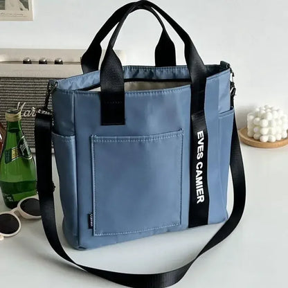 Nuevo bolso de hombro informal de gran capacidad, de nailon, impermeable, de lona, ​​sencillo y moderno, para colegiala.