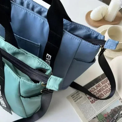 Nuevo bolso de hombro informal de gran capacidad, de nailon, impermeable, de lona, ​​sencillo y moderno, para colegiala.