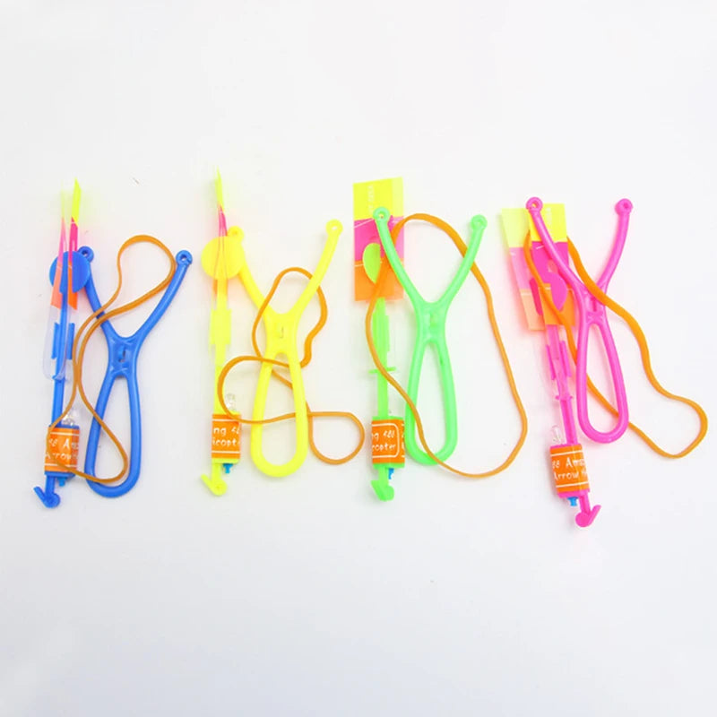 Increíble juguete luminoso, flecha LED, juguetes para fiestas al aire libre, divertido regalo, banda elástica, catapulta que brilla en la oscuridad, cohete, helicóptero, juguete volador.