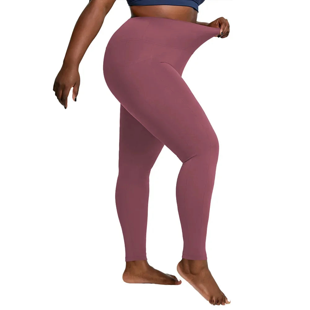 Pantalones deportivos de cintura alta de talla grande con bolsillos laterales dobles, cómodos para yoga y entrenamiento. 