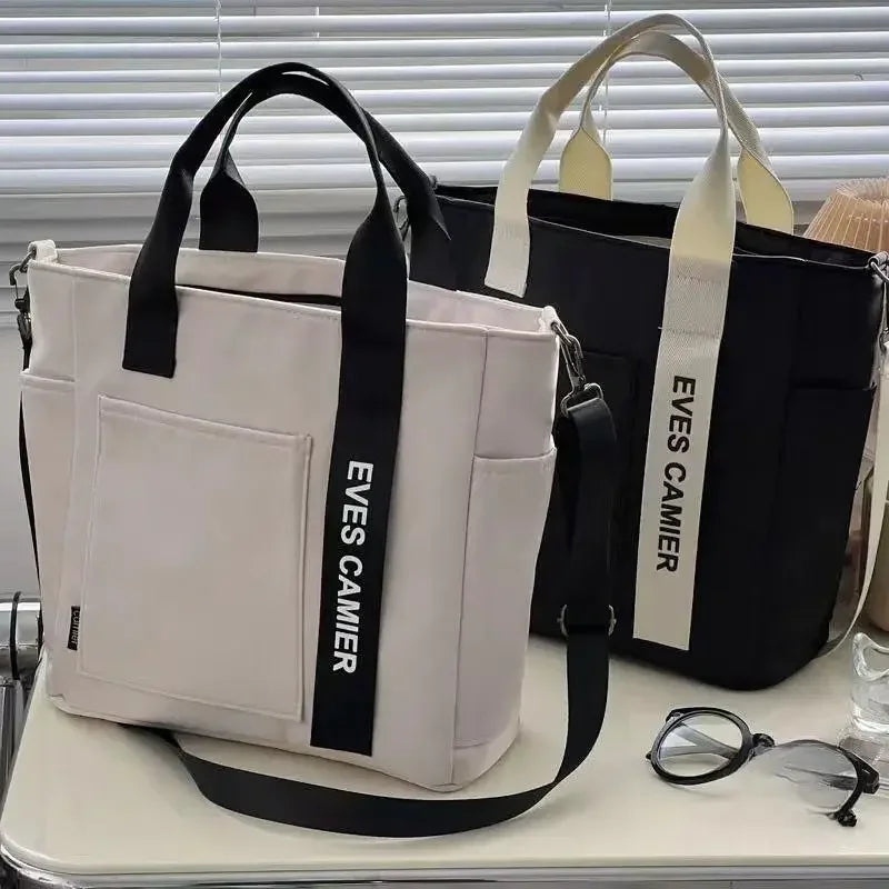 Nuevo bolso de hombro informal de gran capacidad, de nailon, impermeable, de lona, ​​sencillo y moderno, para colegiala.