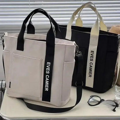 Nuevo bolso de hombro informal de gran capacidad, de nailon, impermeable, de lona, ​​sencillo y moderno, para colegiala.