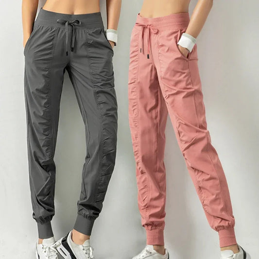 Pantalones deportivos de tela con cordón ajustable para correr, para mujer, de secado rápido, para gimnasio, fitness, con dos bolsillos laterales