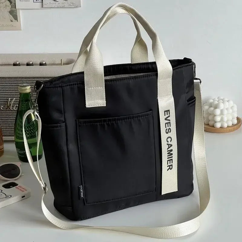 Nuevo bolso de hombro informal de gran capacidad, de nailon, impermeable, de lona, ​​sencillo y moderno, para colegiala.