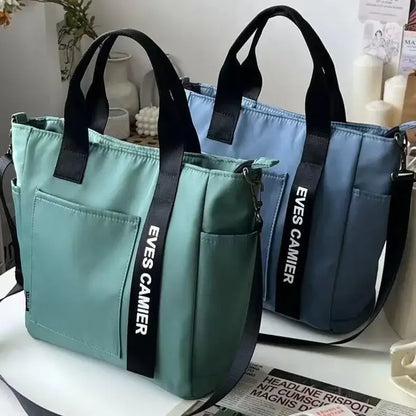 Nuevo bolso de hombro informal de gran capacidad, de nailon, impermeable, de lona, ​​sencillo y moderno, para colegiala.
