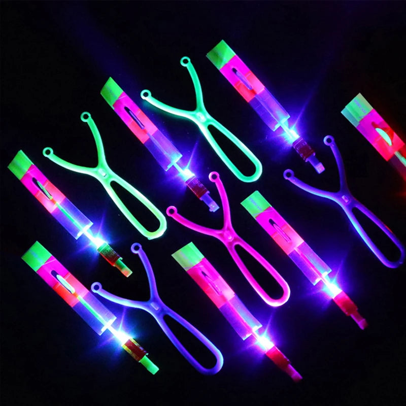Increíble juguete luminoso, flecha LED, juguetes para fiestas al aire libre, divertido regalo, banda elástica, catapulta que brilla en la oscuridad, cohete, helicóptero, juguete volador.