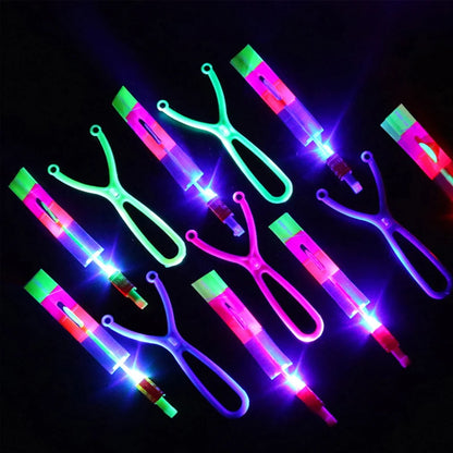 Increíble juguete luminoso, flecha LED, juguetes para fiestas al aire libre, divertido regalo, banda elástica, catapulta que brilla en la oscuridad, cohete, helicóptero, juguete volador.
