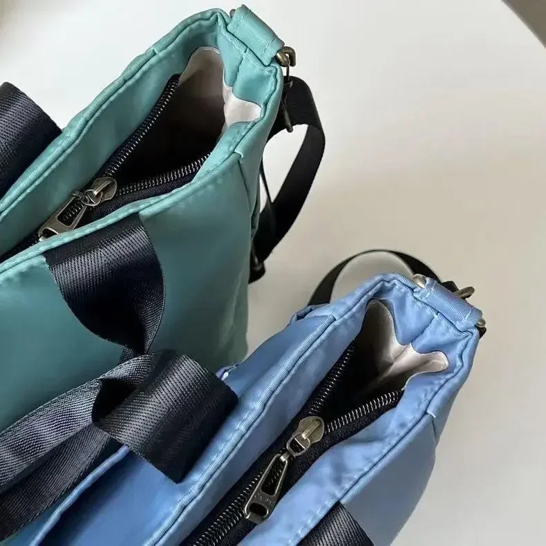 Nuevo bolso de hombro informal de gran capacidad, de nailon, impermeable, de lona, ​​sencillo y moderno, para colegiala.