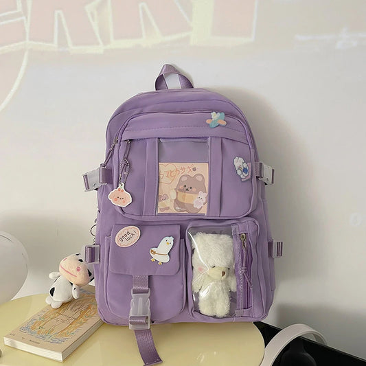 Mochilas populares para estudiantes de secundaria, de color rosa y morado.