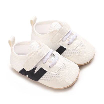 Zapatillas clásicas para bebés recién nacidos con letras entrelazadas, calzado informal antideslizante para caminar, para niños y niñas de 0 a 18 meses