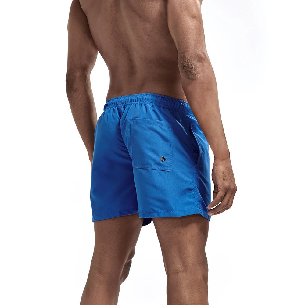 Bañador corto para hombre, de secado rápido, transpirable, con cordón y bolsillos para surfear en la playa en verano.