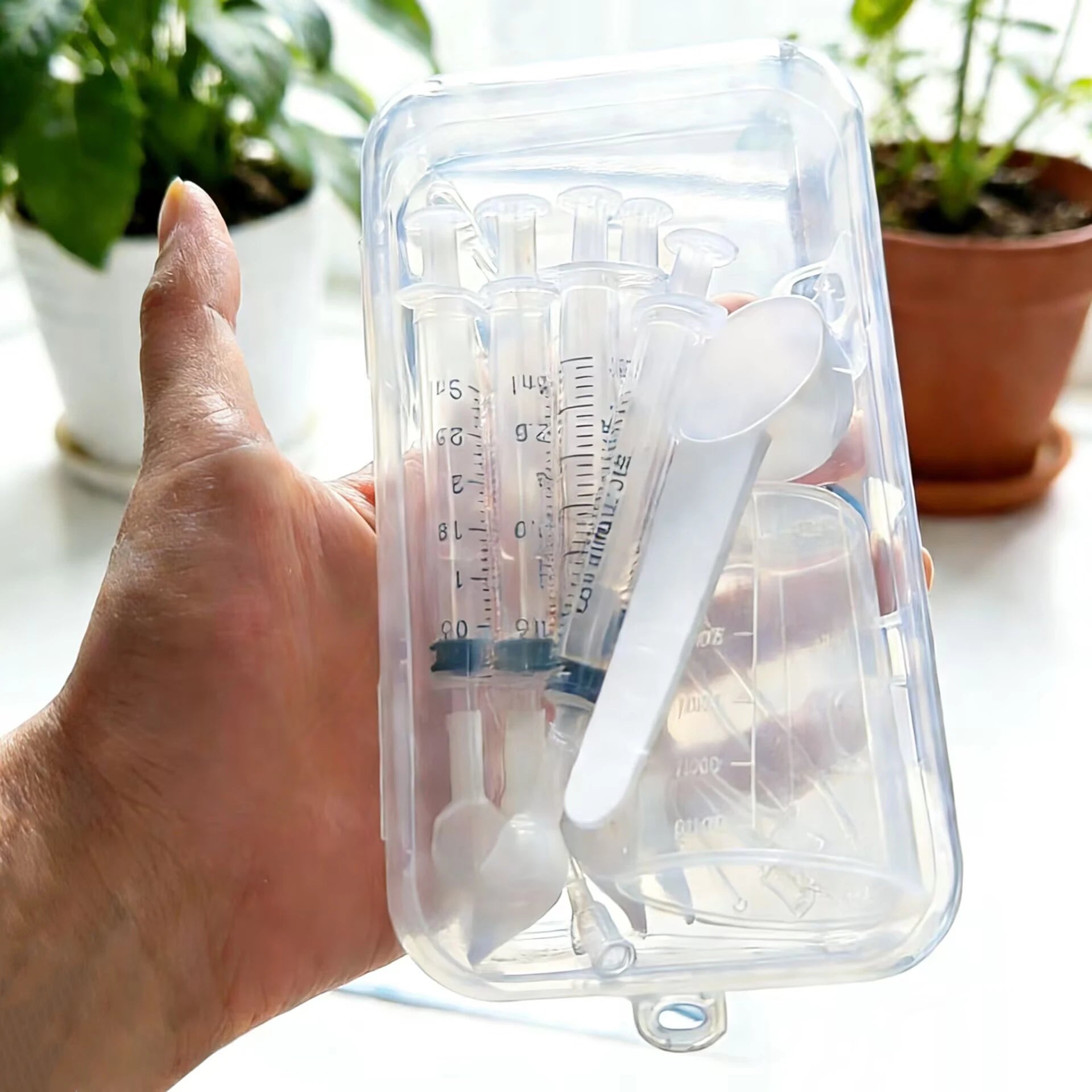 Bird medication feeding kit in a box, 10 feeding tubes, 5 syringes, 5 small spoons, 1 large spoon, measuring cup, and box