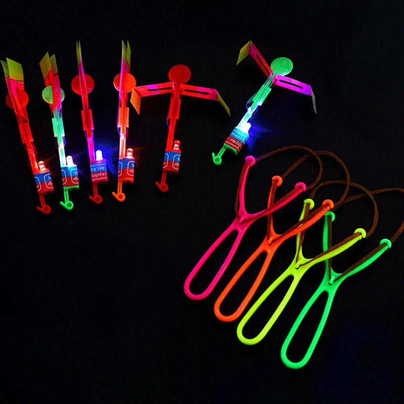 Increíble juguete luminoso, flecha LED, juguetes para fiestas al aire libre, divertido regalo, banda elástica, catapulta que brilla en la oscuridad, cohete, helicóptero, juguete volador.