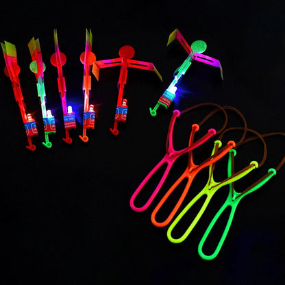 Increíble juguete luminoso, flecha LED, juguetes para fiestas al aire libre, divertido regalo, banda elástica, catapulta que brilla en la oscuridad, cohete, helicóptero, juguete volador.