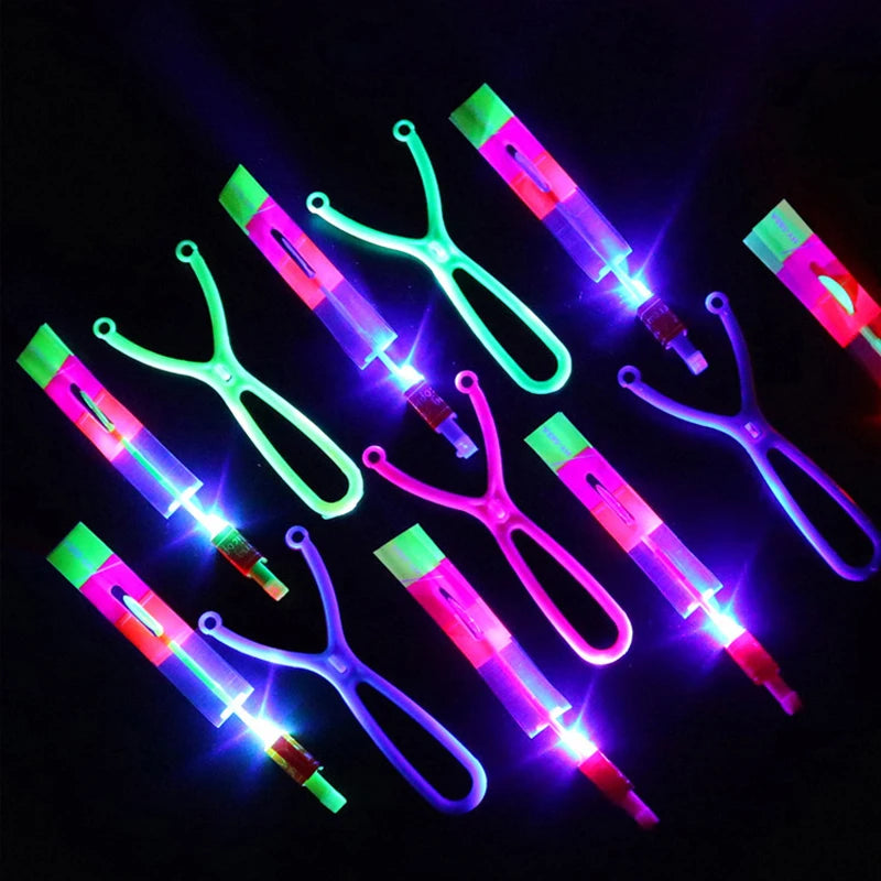 Increíble juguete luminoso, flecha LED, juguetes para fiestas al aire libre, divertido regalo, banda elástica, catapulta que brilla en la oscuridad, cohete, helicóptero, juguete volador.