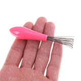 1 pieza de limpiador de cepillos de pelo con peine de color aleatorio, herramienta de limpieza de peine de plástico integrada.