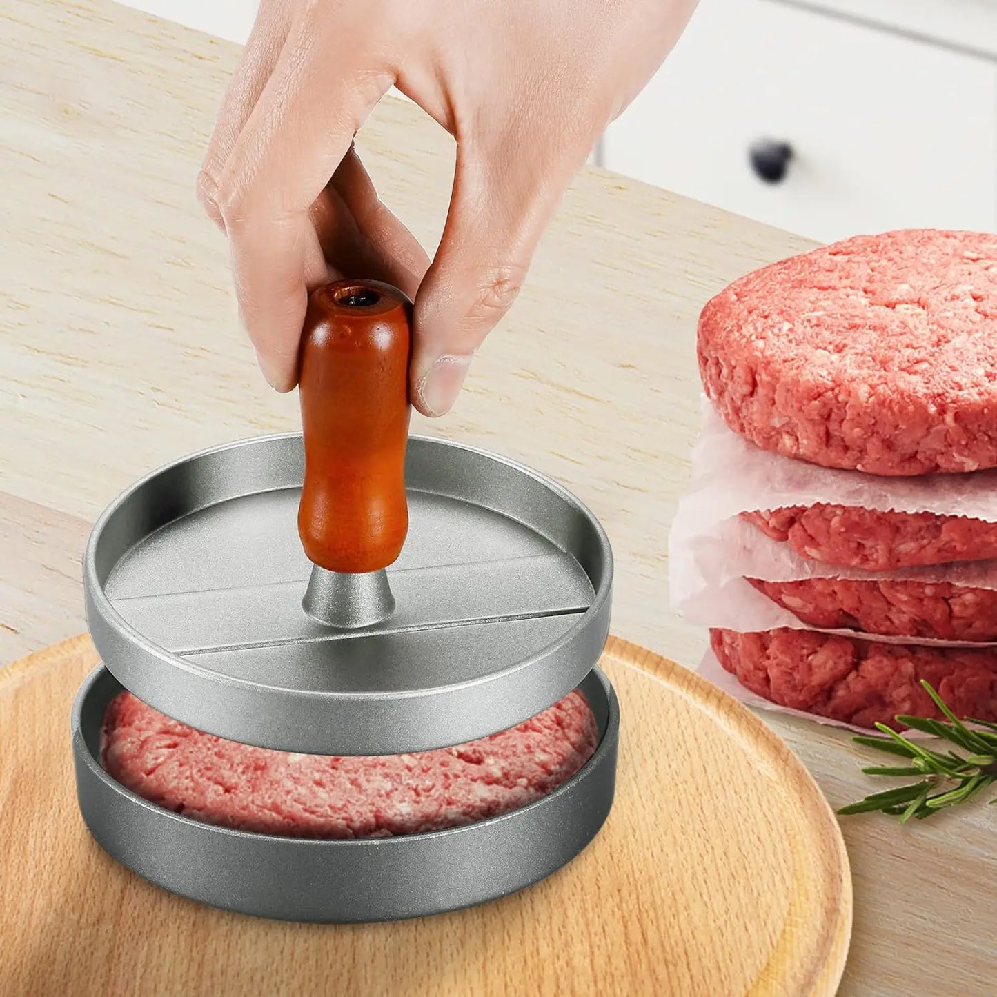 Prensa para hamburguesas de acero inoxidable con mango de madera antiadherente y 100 hojas de papel.