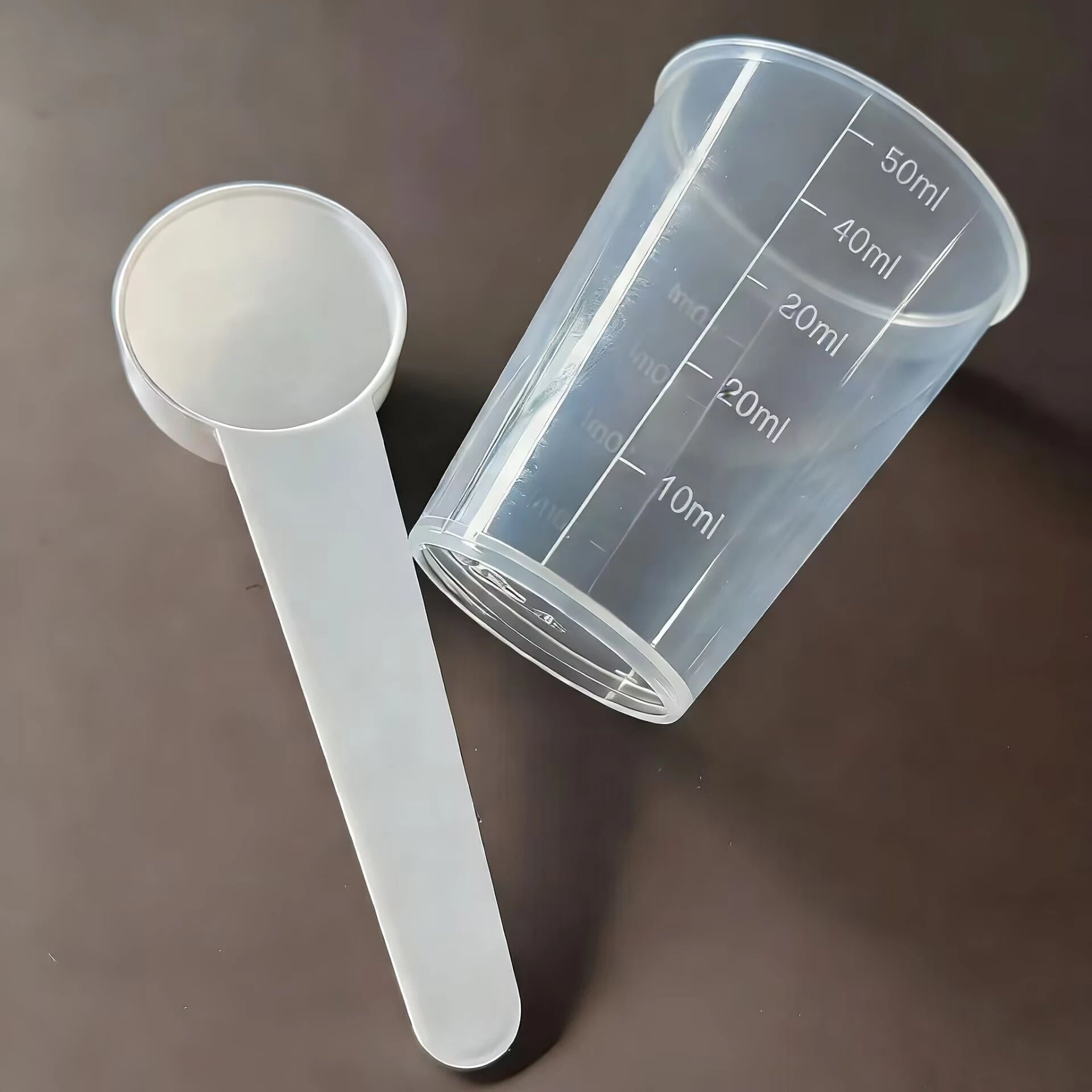 Bird medication feeding kit in a box, 10 feeding tubes, 5 syringes, 5 small spoons, 1 large spoon, measuring cup, and box