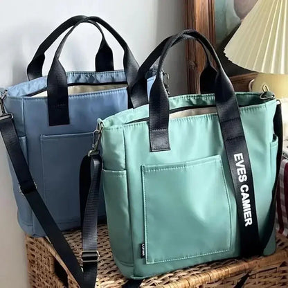 Nuevo bolso de hombro informal de gran capacidad, de nailon, impermeable, de lona, ​​sencillo y moderno, para colegiala.
