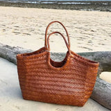 French Leather Woven Bag Fashion Simple Basket Bag Retro Advanced Handmade Bag New Versatile Commuting Women's Shoulder Handbag