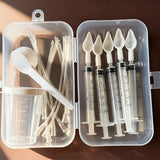 Bird medication feeding kit in a box, 10 feeding tubes, 5 syringes, 5 small spoons, 1 large spoon, measuring cup, and box