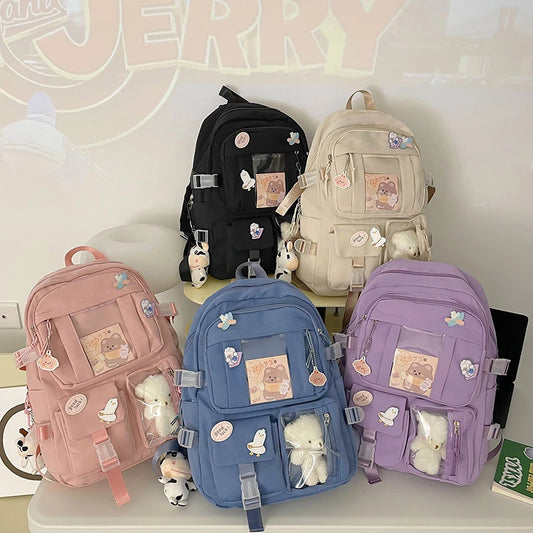 Mochilas populares para estudiantes de secundaria, de color rosa y morado.