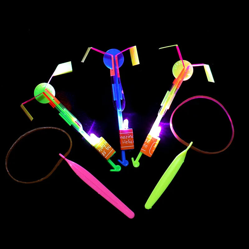 Increíble juguete luminoso, flecha LED, juguetes para fiestas al aire libre, divertido regalo, banda elástica, catapulta que brilla en la oscuridad, cohete, helicóptero, juguete volador.