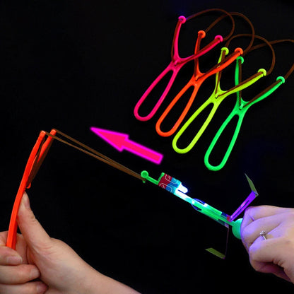 Increíble juguete luminoso, flecha LED, juguetes para fiestas al aire libre, divertido regalo, banda elástica, catapulta que brilla en la oscuridad, cohete, helicóptero, juguete volador.