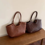 French Leather Woven Bag Fashion Simple Basket Bag Retro Advanced Handmade Bag New Versatile Commuting Women's Shoulder Handbag