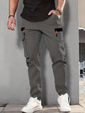 Pantalones cargo con puños y bolsillos de solapa para hombre, de color liso, transpirables y cómodos para actividades al aire libre.