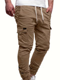 Pantalones cargo lisos de corte regular con puños y bolsillos con solapa para hombre. Elegantes y modernos pantalones de ocio con cordón ajustable para uso diario.